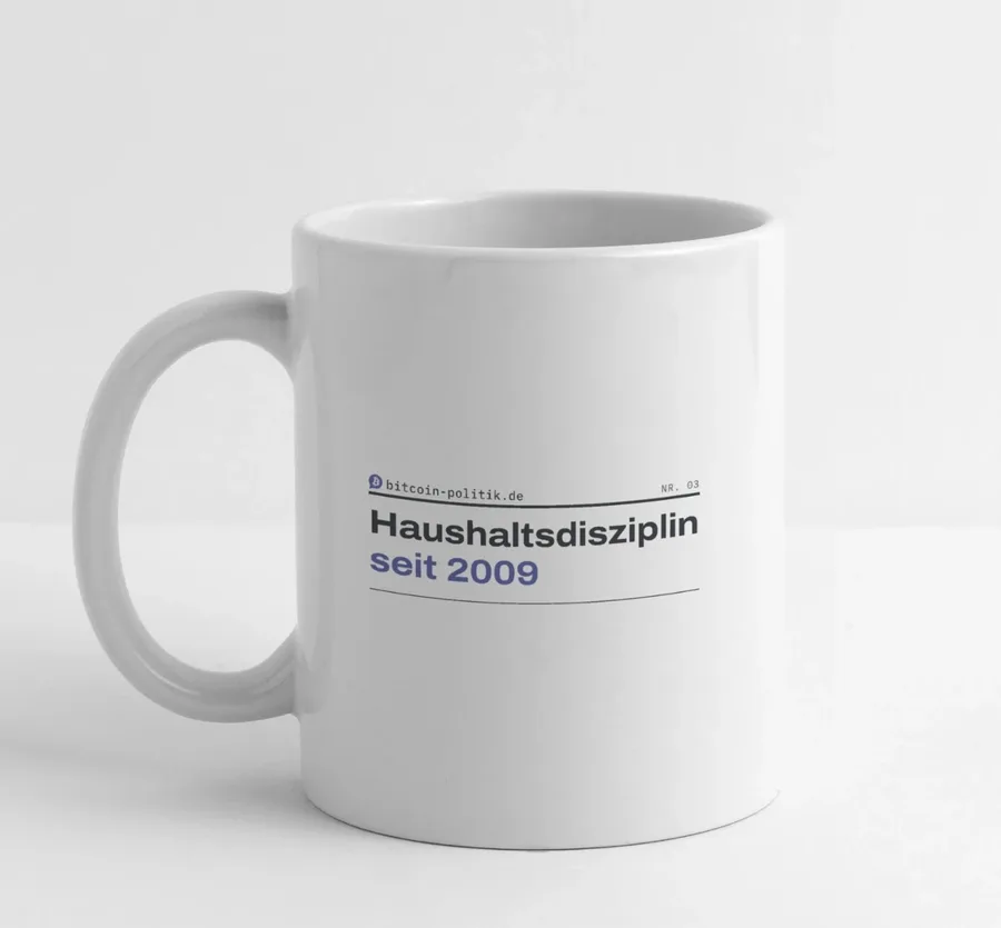 Weiße Tasse mit dem Spruch „Haushaltsdisziplin seit 2009“